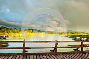 Double rainbows over the lake and houseboat community on rainy day