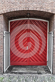 Double red door built into a wall