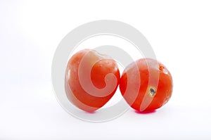 Double red tomato isolated on white