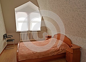 The double room on the mansard floor of cheap hotel