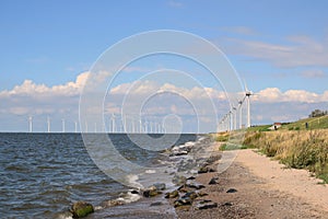 The double row of windmills at Urk in the IJsselmeer. All belonging to the wind farm