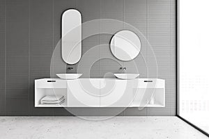 Double sink in modern gray bathroom