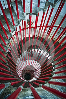 Double spiral staircase and red balustrade.