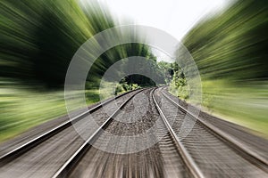 Double-track railroad railway or train tracks speed motion blur