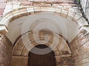 Double bent arch of the church of Santa Maria de Prades, Tarragona, Spain, Europe photo