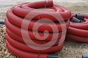 Double-walled corrugated pipes with soft broach in coilsHDPE corrugated pipe with double wall strength at the construction site.