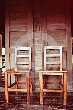 Double wooden chairs on wood house thai retro style