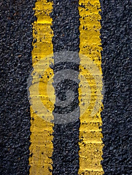 Double Yellow Lines in the Tarmac on the Road