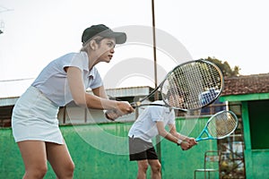 doubles tennis player ready to receive the ball