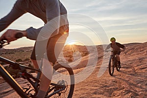 When in doubt, bike it out. Full length shot of two young male athletes mountain biking in the wilderness.