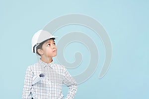 Doubt engineer boy with white helmet looking upward