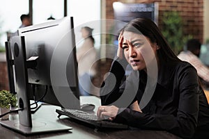 Doubtful asian computer engineer puzzled by nonfunctional security algorithm