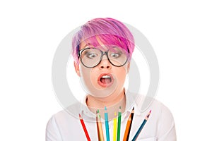 Doubtful business woman thinking looking on colored pencils