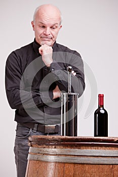 Doubtful man about wine quality controls
