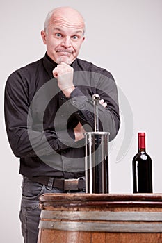 Doubtful man about wine quality controls