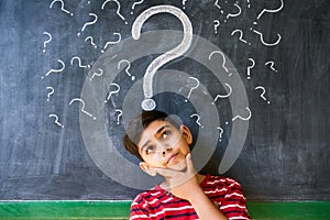 Doubts And Question Marks With Child Thinking At School