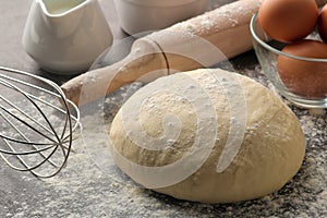 Dough for baking. making delicious cookies. Ingredients for the dough, eggs, flour, butter, sugar on a dark background