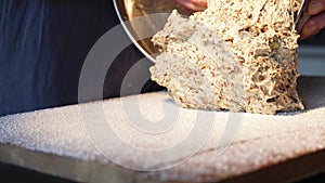 Dough from a bowl into work surface