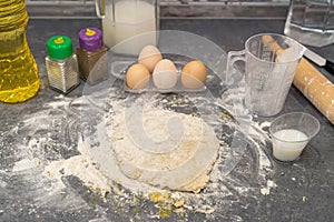 dough flour eggs oil laid out on the kitchen table to prepare khachapuri in Ajax.