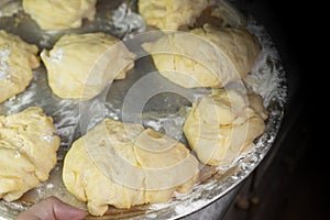 Dough pieces on a tray For further baking