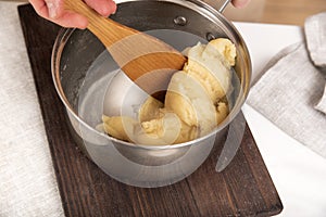 Dough preparation process. Mixing ingredients in saucepan. Receipes