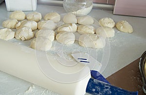 Dough, rolling pin, flour for making fresh homemade cakes