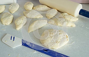 Dough, rolling pin, flour for making fresh homemade cakes