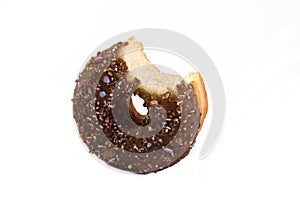Doughnut with bite taken over white
