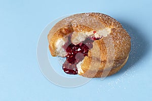 Doughnut with jam. Berliner donut with raspberry filling. German food