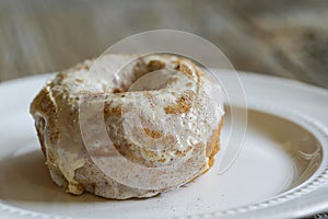 Doughnut server on plate with rustic background