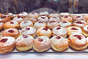 Doughnut sufganiyot for Hanukkah celebration in bakery shop