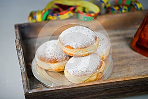 Doughnut on tablet, with air snake and colorful hat