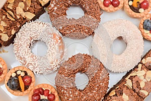 Doughnuts covered with white and brown chocolate