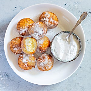 Doughnuts. Homemade cakes made from curd balls. Freshly made donuts from cottage cheese with powdered sugar. Cottage cheese donuts