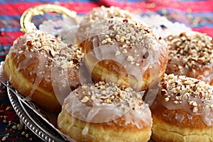 Doughnuts with icing and cashews