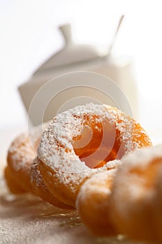 Doughnuts and sugar bowl photo