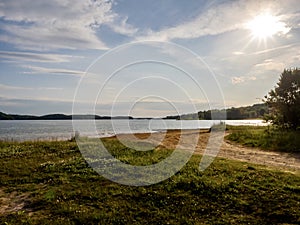 Douglas Lake in the spring in Tennessee with the Great Smoky Mountains in the background, the water and sandy shore with a blue photo