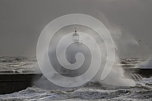 Douro river mouth new north pier and beacon under heavy storm