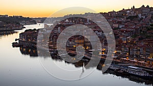 Douro river and Ribeira from Dom Luis I bridge at night time, Porto.