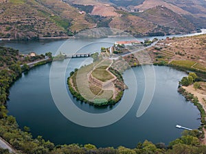 Douro wine valley region, Portugal. Vineyards landscape with beautiful farm. Tourist attraction and travel destination. Drone aeri