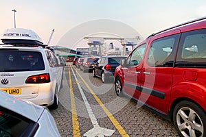 Dover, England - July 27 2018: Cars at the ferry port in early morning, waiting to board the cross channel ferry boat