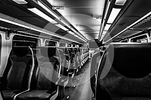 Dover, NJ USA - November 1, 2017: NJ Transit train at night with empty seats, black and white