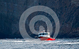 Down east style lobster boat at Coche Point off the coast of Santa Cruz Island in the Channel Islands off the California coast USA photo