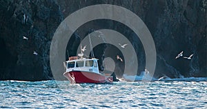 Down east style lobster boat at Coche Point off the coast of Santa Cruz Island in the Channel Islands off the California coast USA photo