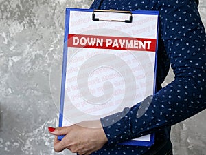 DOWN PAYMENT sign on the piece of paper