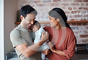 Down syndrome, happy family and baby in a kitchen, bonding and embracing in their home together. Child development, love