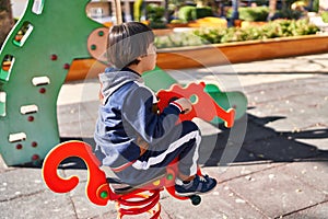 Down syndrome kid playing at park