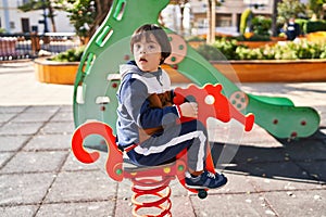 Down syndrome kid playing at park