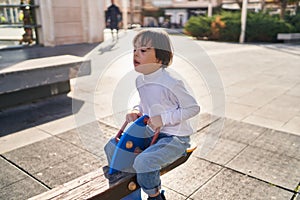 Down syndrome kid playing at park