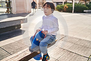 Down syndrome kid playing at park